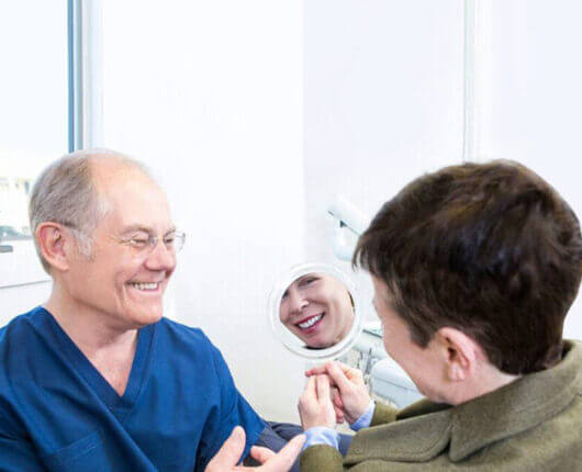 Dr. Harry Strating with a female patient